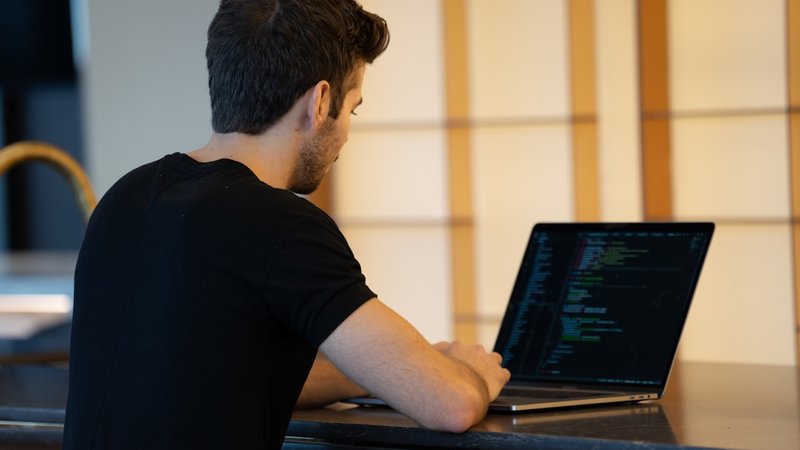 Modern coding workspace with AI assistant on screen