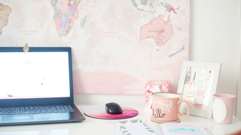 desk with laptop and notebook for blogging side hustle