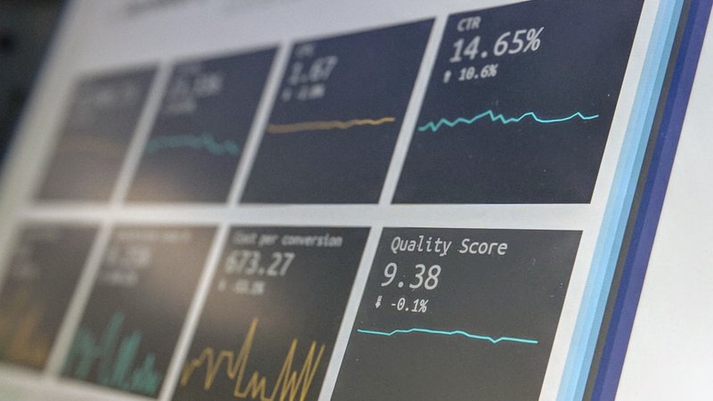 Tech professional analyzing AI trends on multiple screens